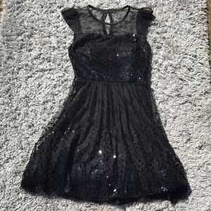 Delia’s black party dress